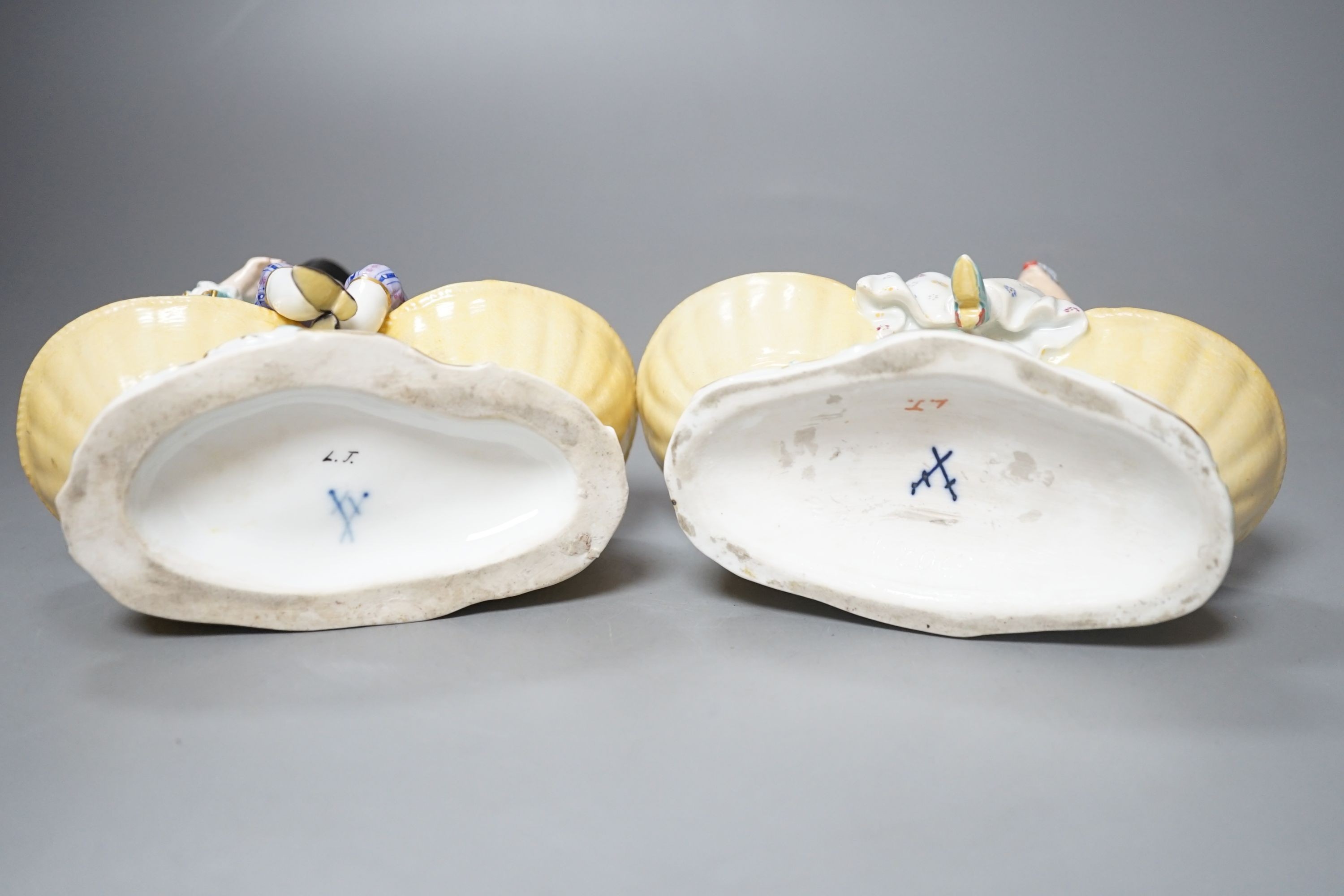 A pair of Meissen porcelain figural sweetmeat baskets, one incised number 3024, both initialled L.J.